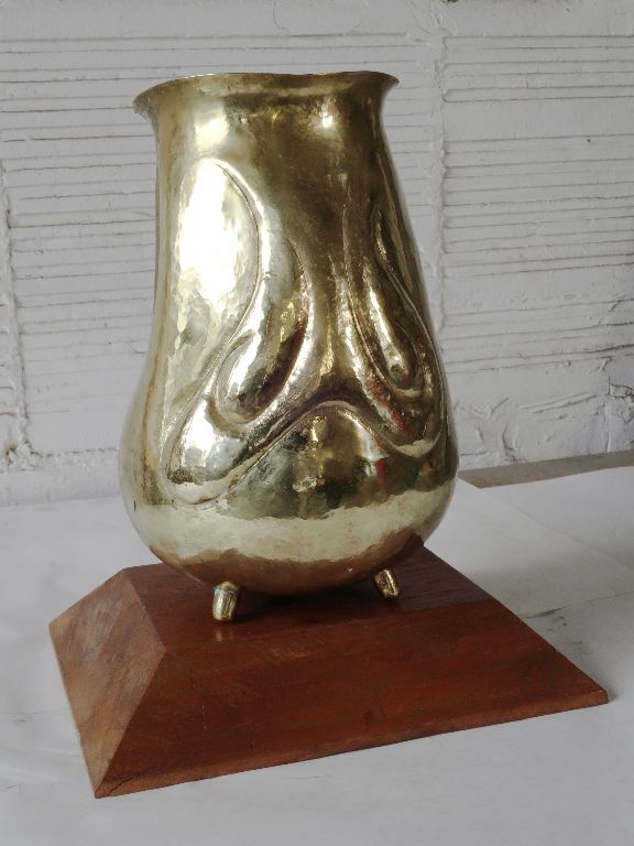 Brass vase on walnut base (approx. 10" tall)
