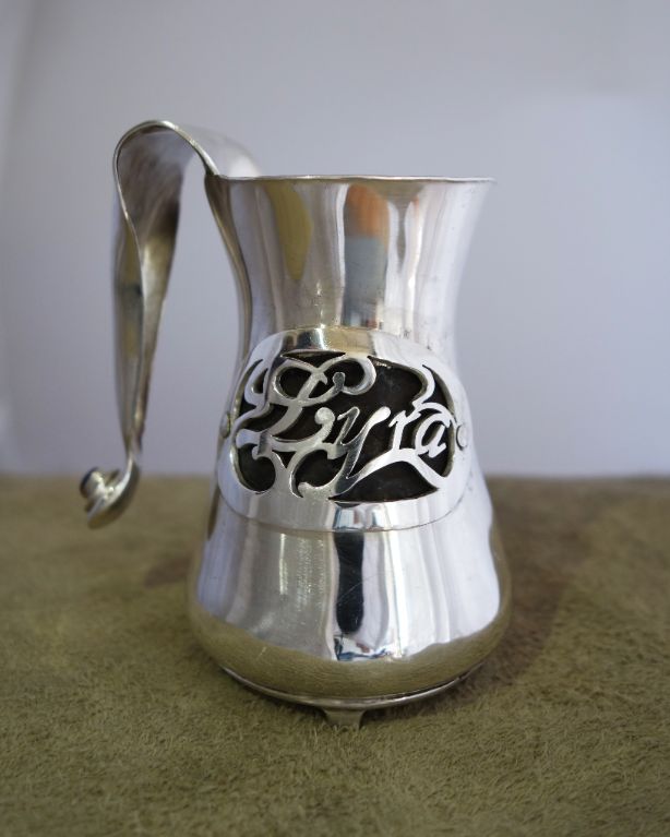 Silver pitcher with name (side view)