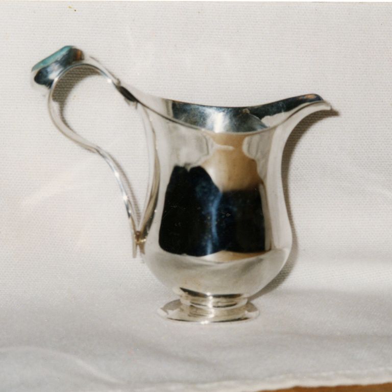 Silver pitcher with stone on handle