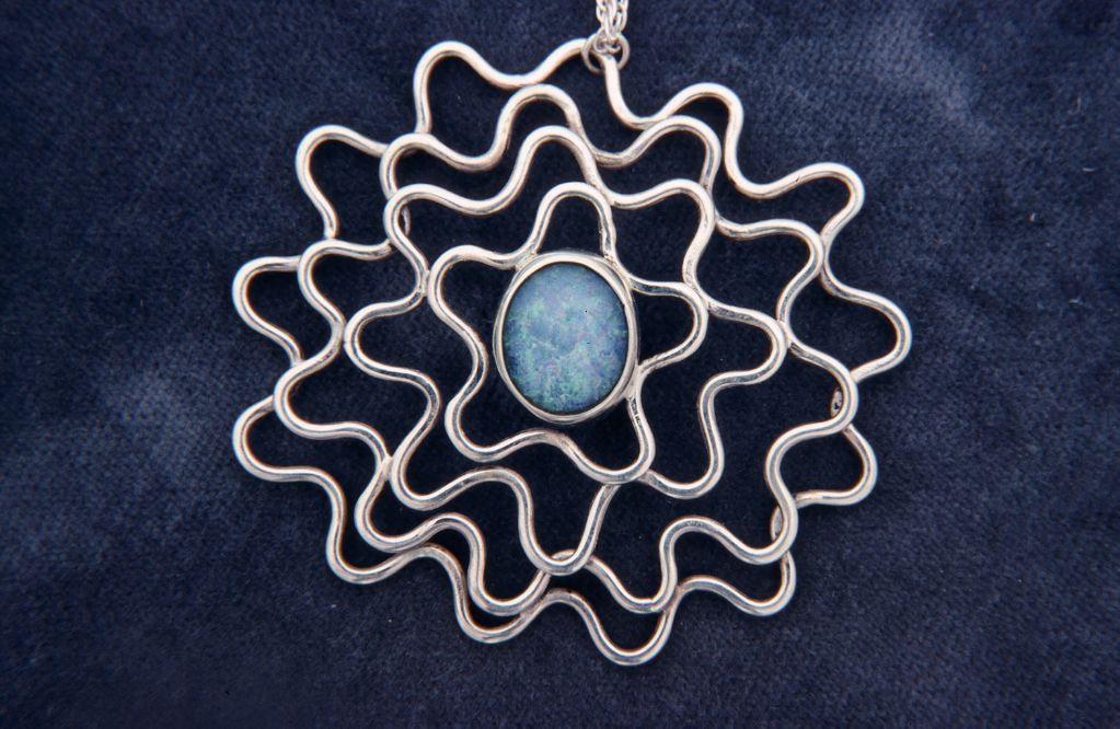 Pendant of silver wire with opal