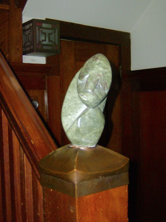 Copper newel post cap and sculpture base (Shona sculpture on top)